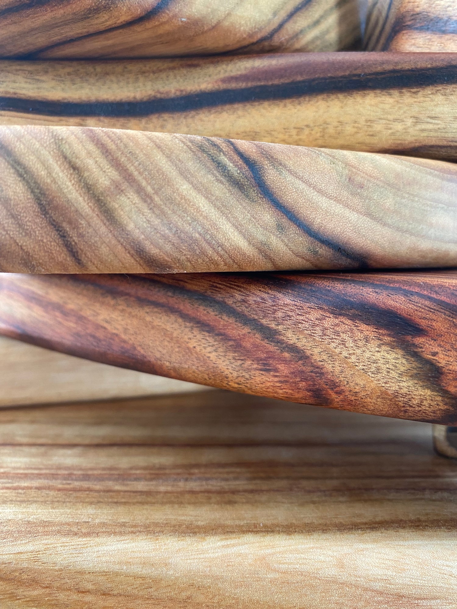 Close up of Nature's Boards, beautiful camphor laurel cutting boards with buttery soft texture and gorgeous blonde and dark grains.