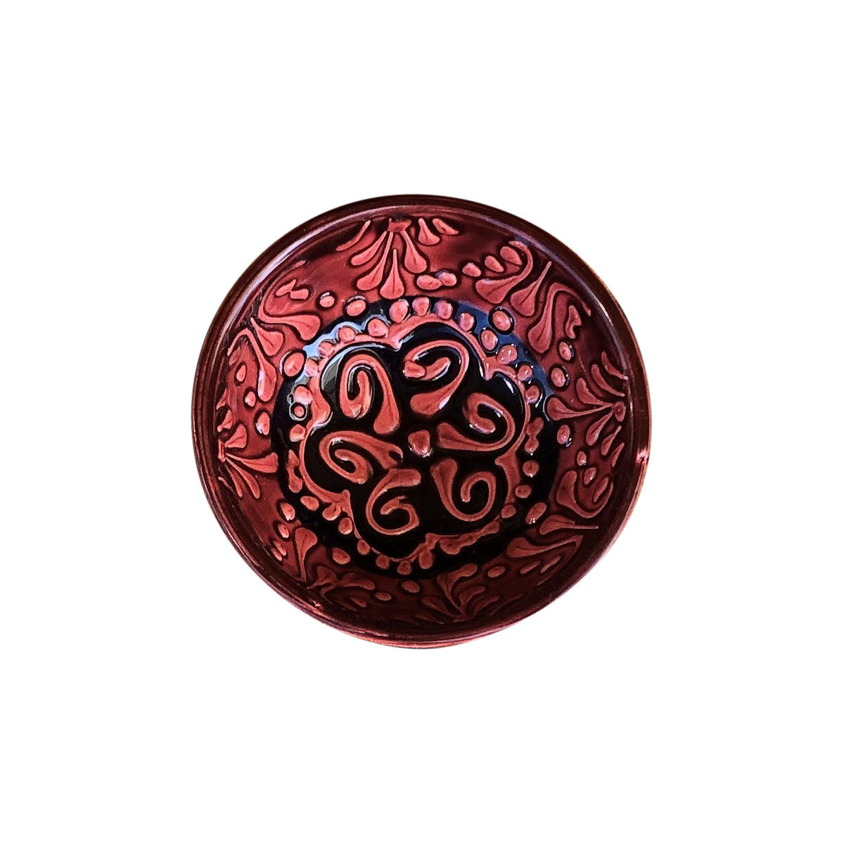 A small red and black handmade Turkish bowl with a patterned design.