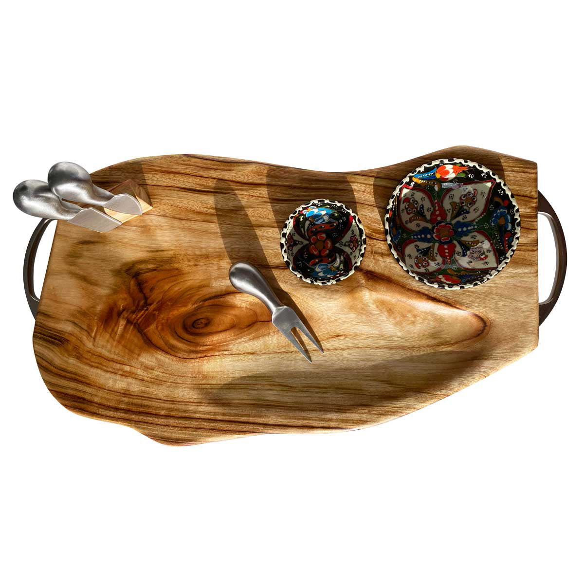 A stunning camphor laurel wooden food platter with stainless steel cheese tools and one small and one medium hand-crafted Turkish bowl, ready to create a charcuterie or cheese board.